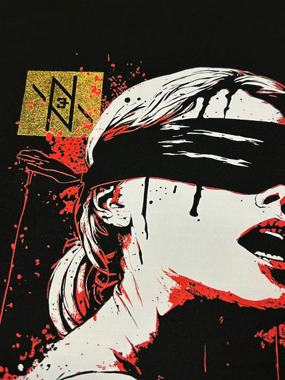 First close-up of the Noir et Noir Veiled Revelations unisex T-shirt, focusing on the detailed high-contrast design with red accents and gold foil elements. Showcasing the artistic and high-quality print.